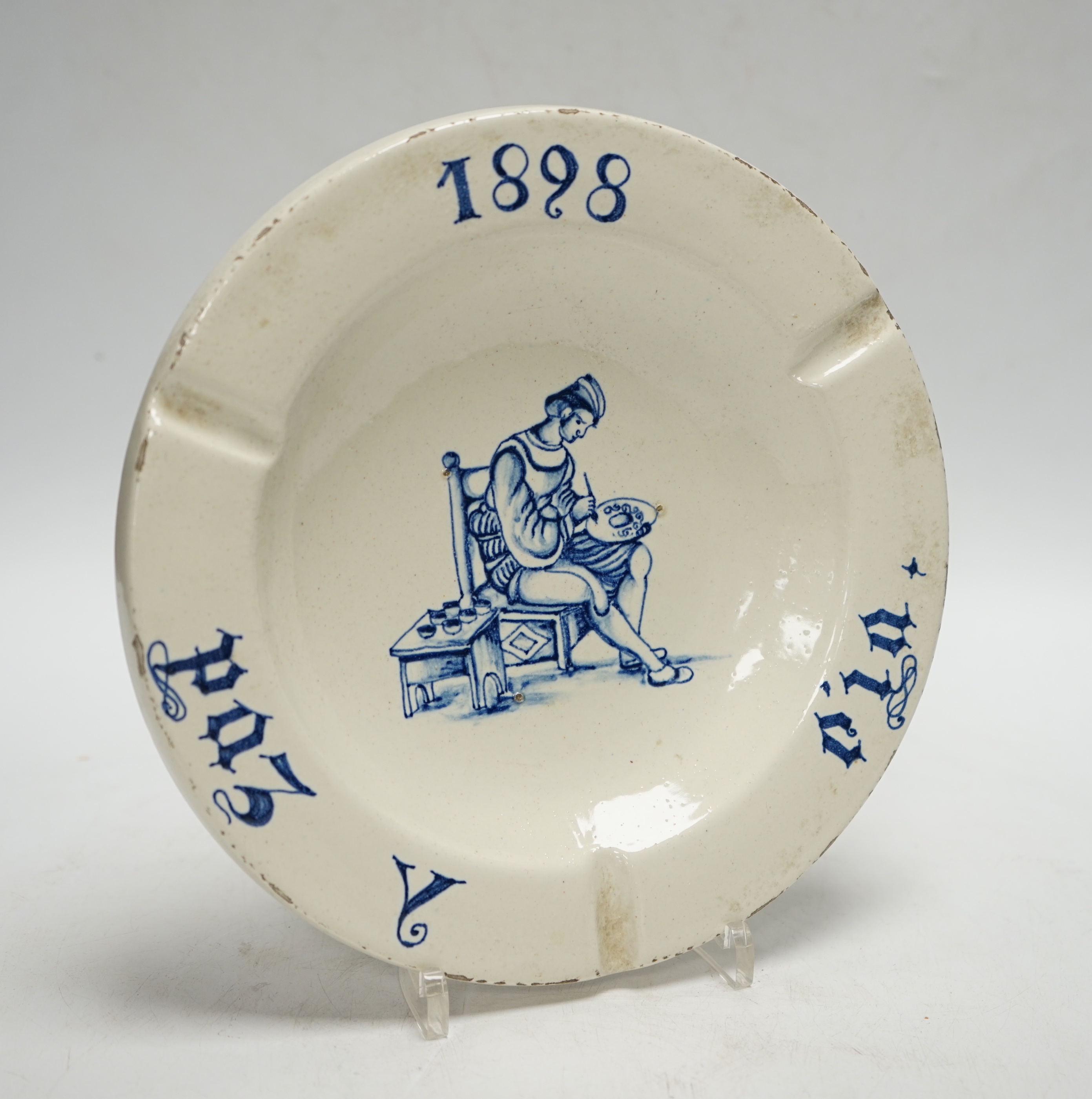 A Spanish maiolica ashtray, bearing date 1898, 21cm diameter